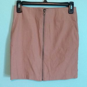 Blush body con mini skirt with front zipper